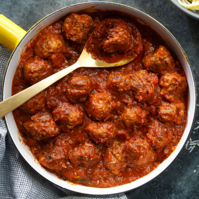 Traditional Bosnian meatballs in sauce served at Kašika Viljuška Nož in Sarajevo